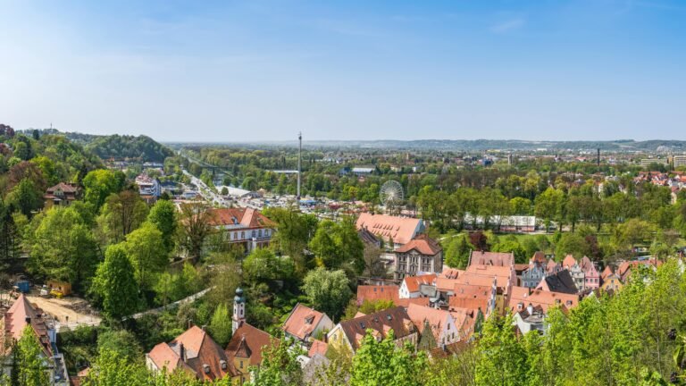 Panoramic view of Landshut, showcasing the town's traditional architecture and green landscapes.