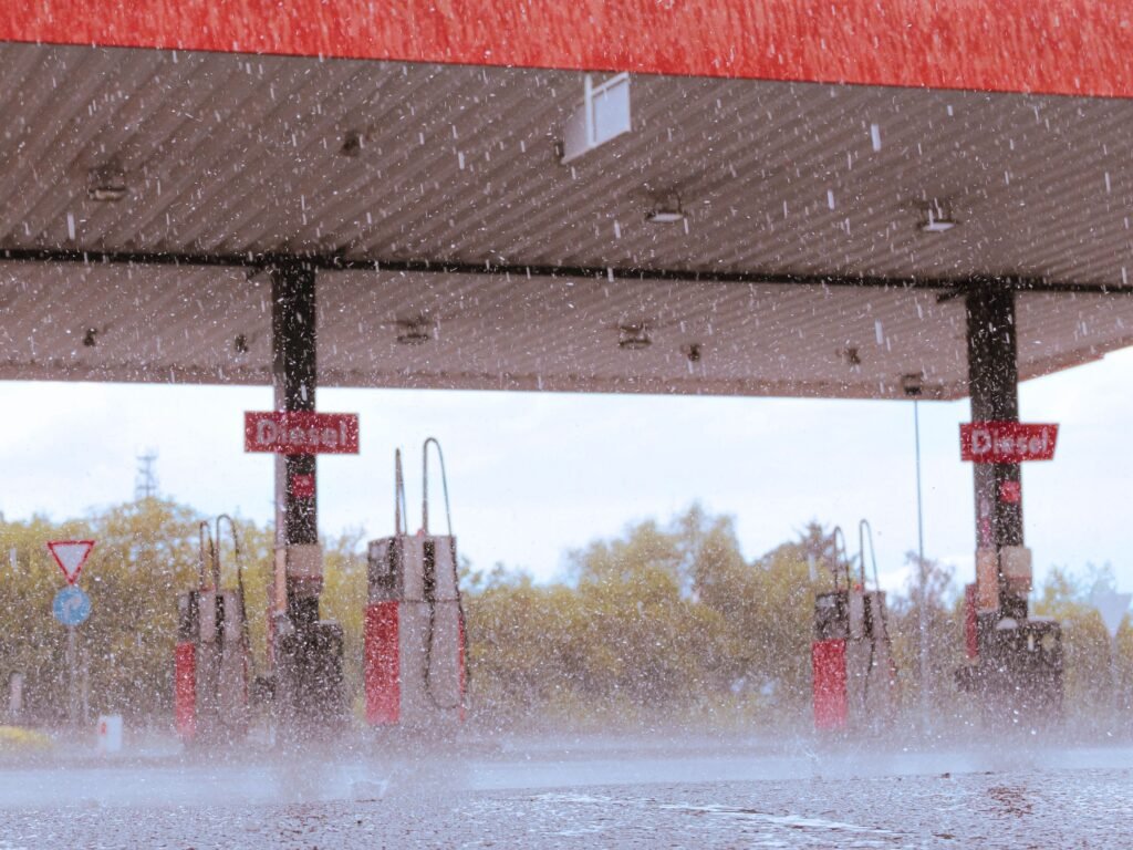 A gas station in Dallgow-Döberitz, Germany, during a rainy day. Winterdiesel Wohnmobil an der Tankstelle bei Frost