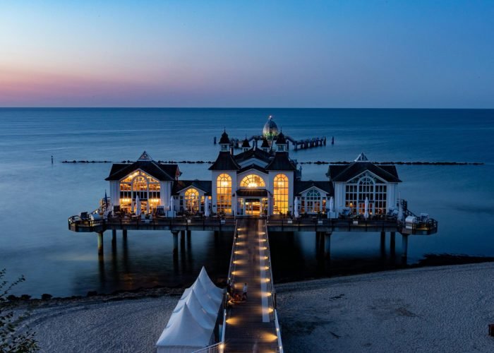 Stunning sunset view of the iconic Sellin Pier on Rügen Island, Germany.