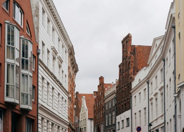 pexels-photo-18879533-18879533 Explore the historic architecture and cobbled streets of Lübeck, Germany, showcasing iconic brick facades.