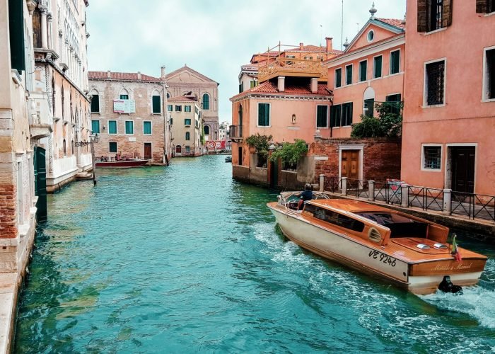 pexels-photo-208701-208701 Picturesque view of Venice's canals with charming architecture and traditional boat.