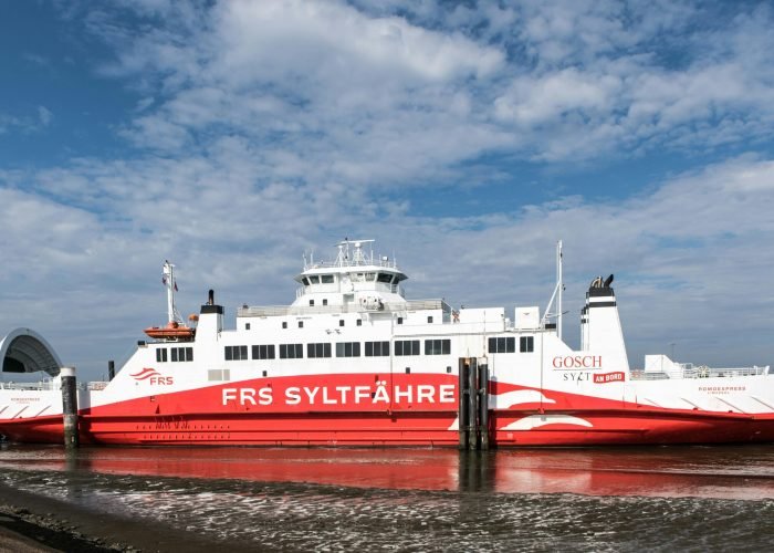 A ferry from FRS Syltfähre docked at the picturesque Rømø port in Denmark. A ferry from FRS Syltfähre docked at the picturesque Rømø port in Denmark.