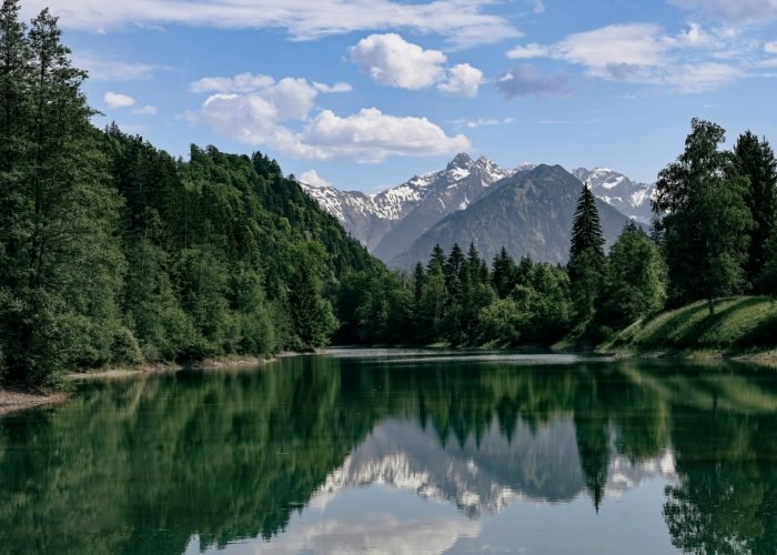 Breathtaking view of a serene lake reflecting alpine mountains in Fischen im Allgäu, Bavaria. Breathtaking view of a serene lake reflecting alpine mountains in Fischen im Allgäu, Bavaria.