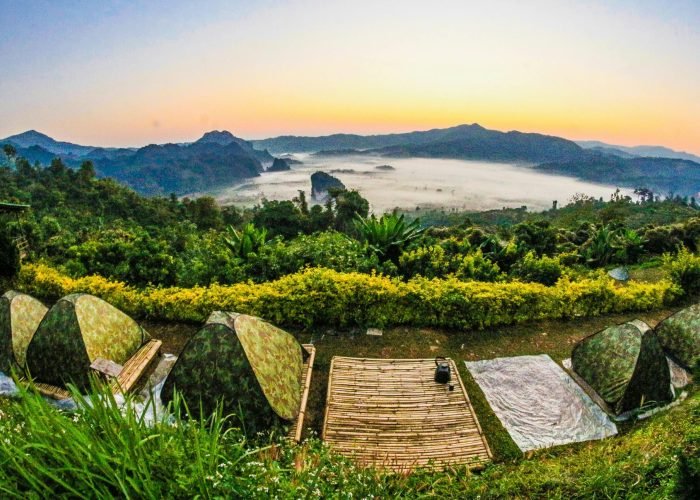 pexels-photo-730426-730426 Experience a breathtaking sunrise view with camouflaged tents set in a lush, mountainous landscape.